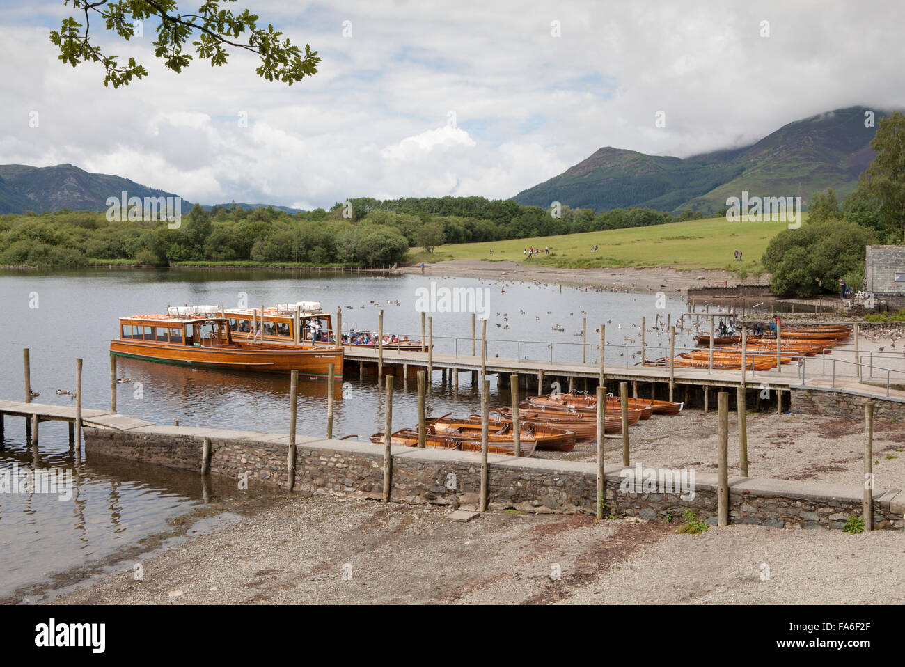 A launch and row boats are moored at Keswick boat landing on