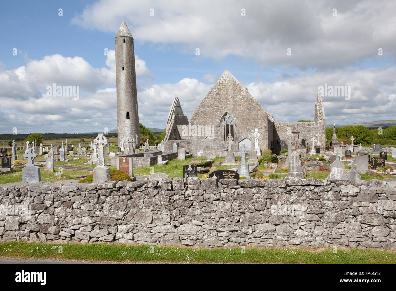 Kilmacduagh Monastery is a ruined abbey near the town of Gort in County Galway, Ireland Stock Photo
