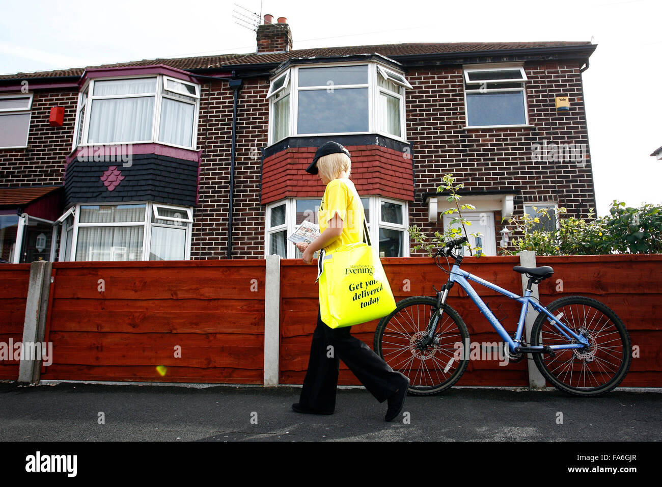 A papergirl on a newspaper round Stock Photo Alamy