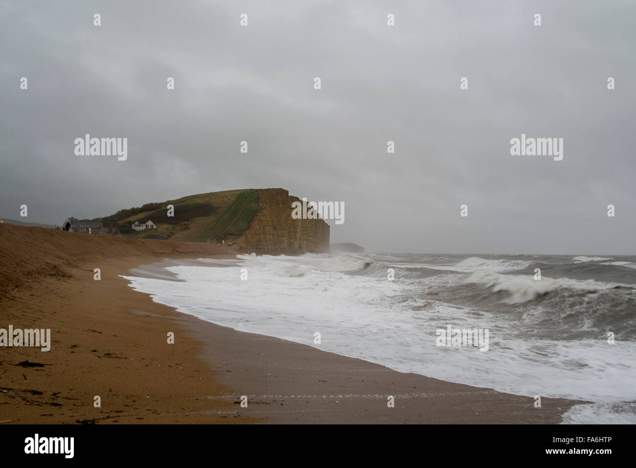 West Bay UK Weather 22nd December 2015 Strong winds and big waves on West bay beach Credit:  Paul Chambers/Alamy Live News Stock Photo