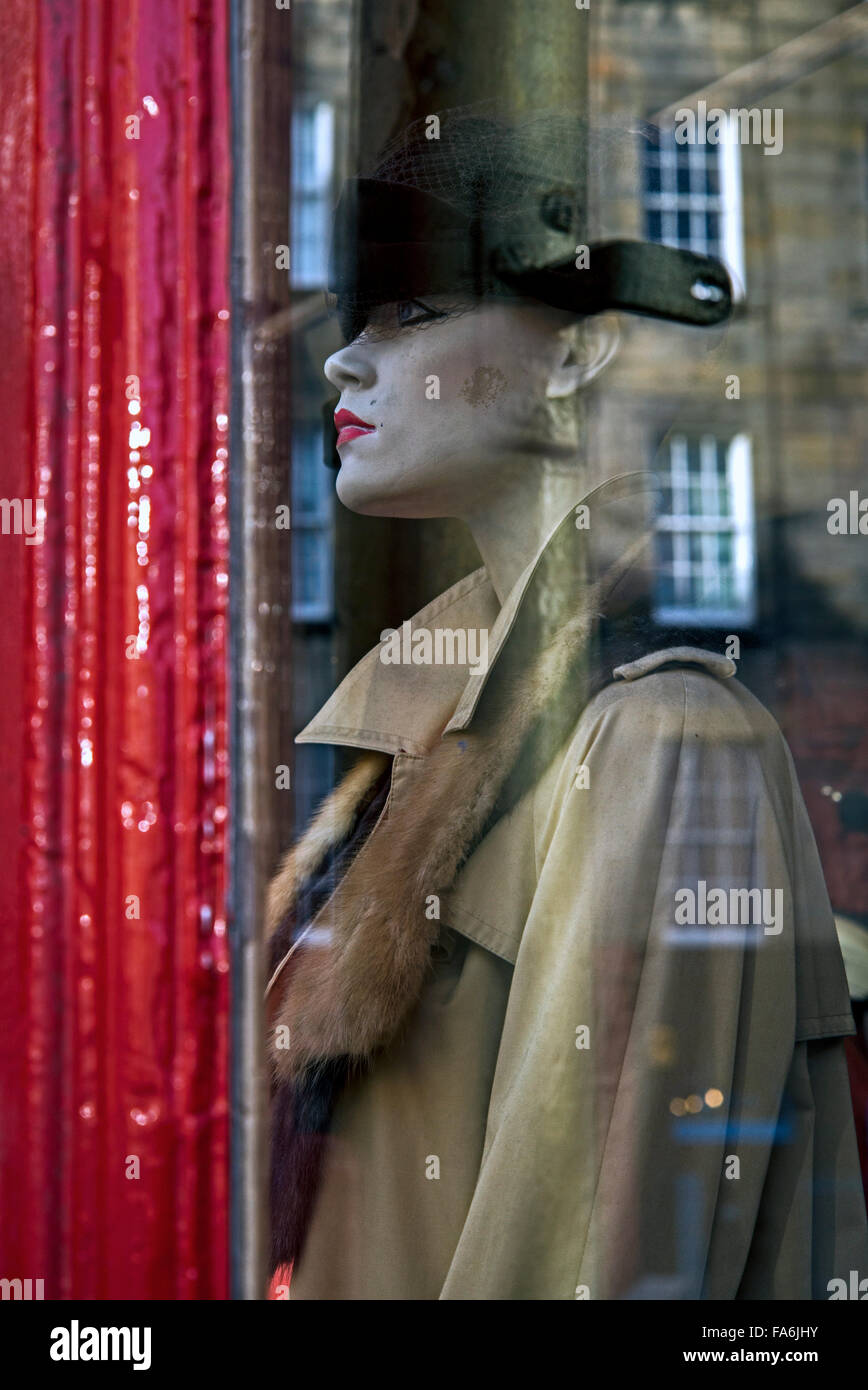 Mannequin and reflections in the window of Armstrongs vintage clothing stor in the Grassmarket, Edinburgh, Scotland, UK Stock Photo