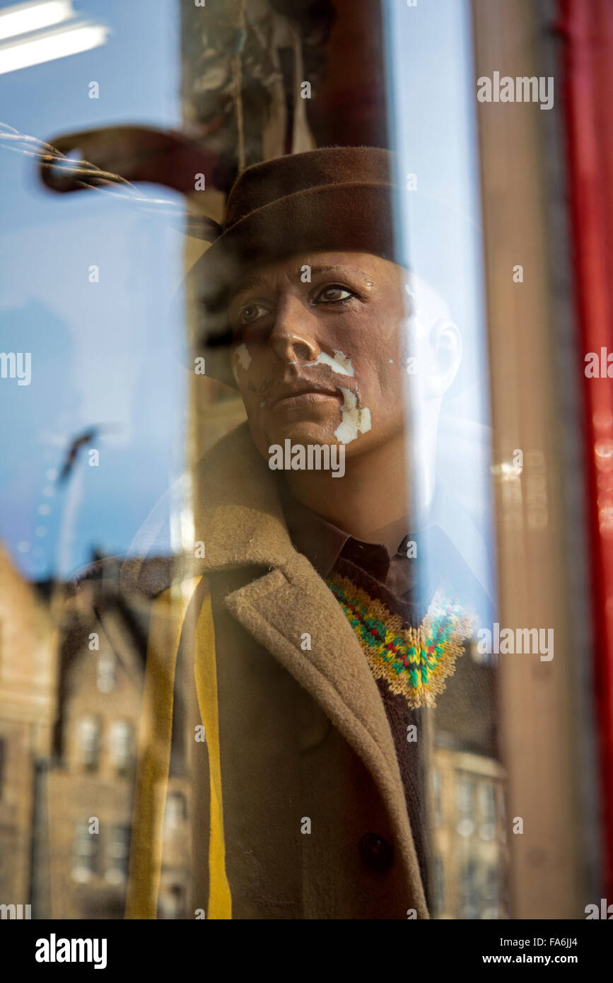 Mannequin and reflections in the window of Armstrongs vintage clothing store in the Grassmarket, Edinburgh, Scotland, UK Stock Photo