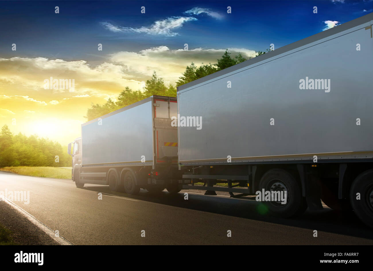 Truck trailer on the highway in a commercial trip. Stock Photo