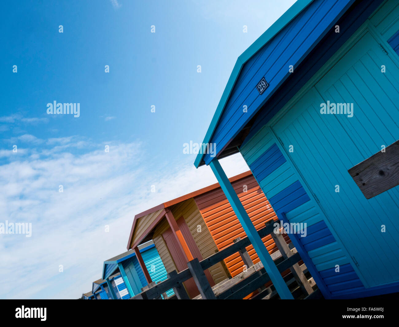 Colourful beach huts along the coast near Whitstable, Kent, UK Stock Photo