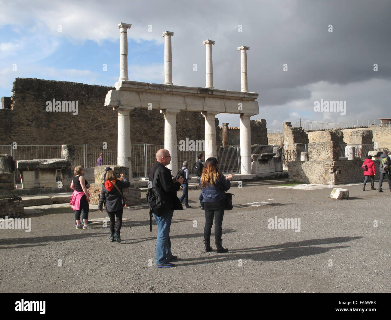 Pompeii, Italy. 1st Dec, 2015. Tourists in Pompeii, Italy, 1 December 2015. For years, ruins and even entire buildings were collapsing in Pompeii. In 2013, the EU provided a great deal of money for its rescue, since when it is being restored. PHOTO: ALVISE ARMELLINI/DPA/Alamy Live News Stock Photo