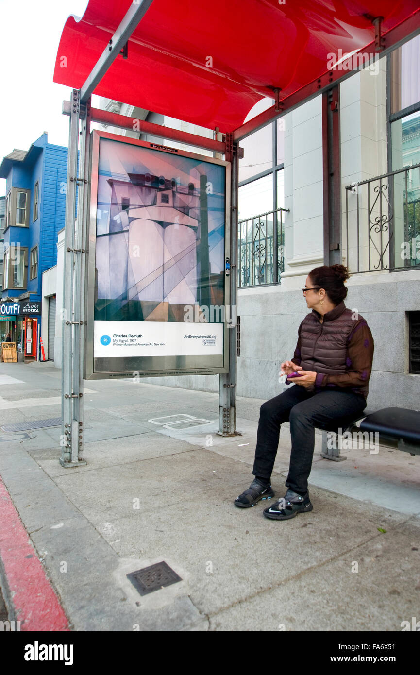 A Charles Demuth painting appears on a bus shelter kiosk in San Francisco during the Art Everywhere event. Stock Photo