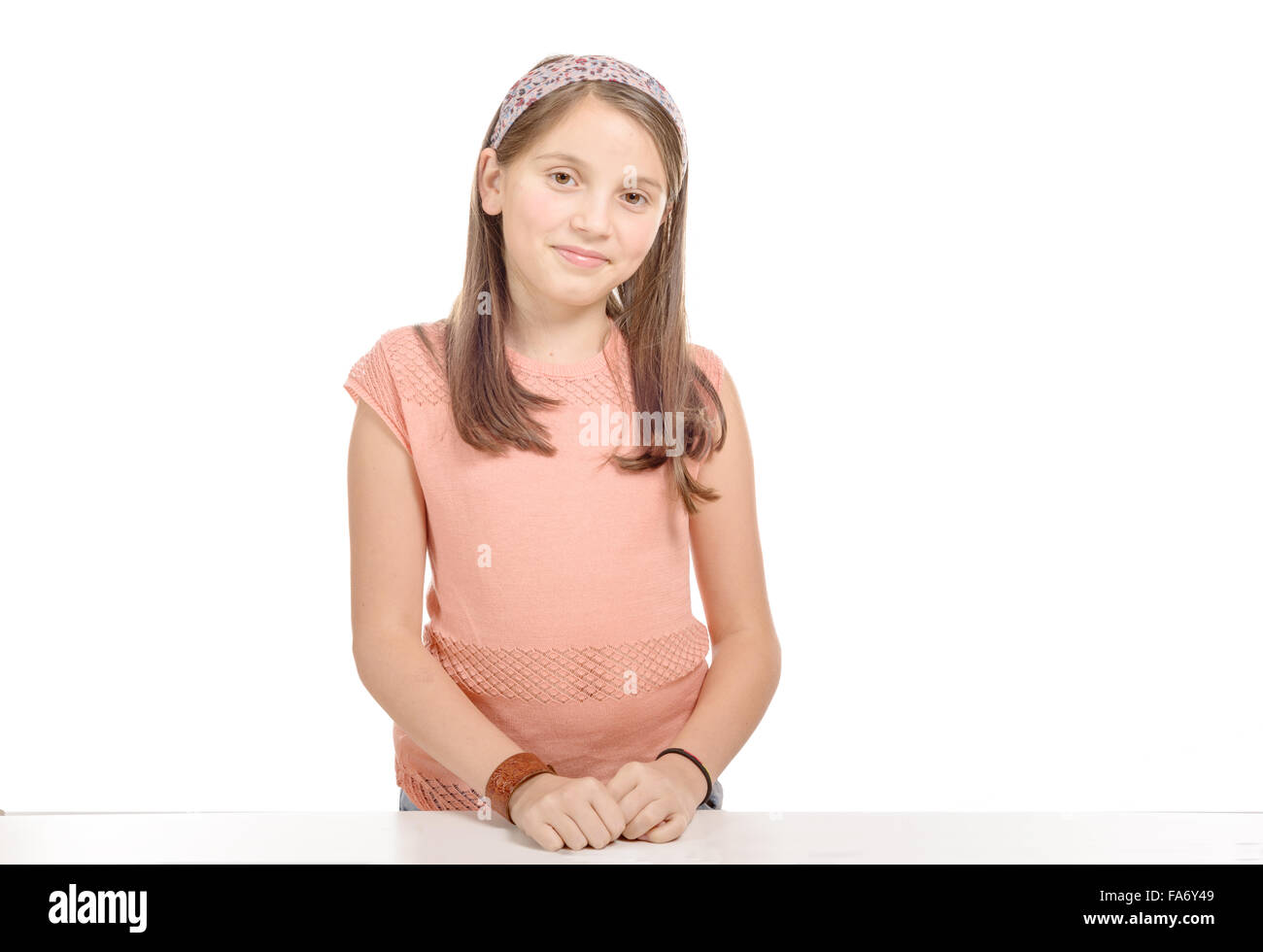 a beautiful young teenage girl smiling and looking into the camera Stock Photo