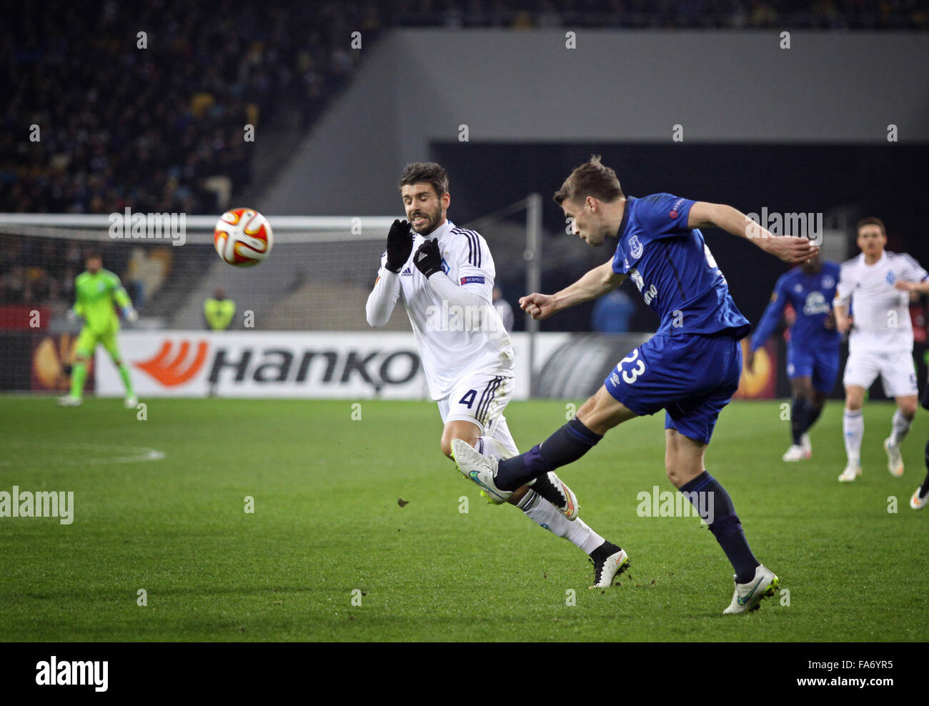 KYIV, UKRAINE - MARCH 19, 2015: Miguel Veloso of FC Dynamo Kyiv (L) fights for a ball with Seamus Coleman of FC Everton during their UEFA Europa League game at Olympic stadium in Kyiv Stock Photo