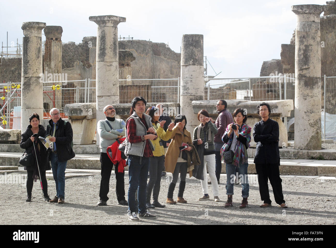 Pompeii, Italy. 1st Dec, 2015. Tourists in Pompeii, Italy, 1 December 2015. For years, ruins and even entire buildings were collapsing in Pompeii. In 2013, the EU provided a great deal of money for its rescue, since when it is being restored. PHOTO: ALVISE ARMELLINI/DPA/Alamy Live News Stock Photo
