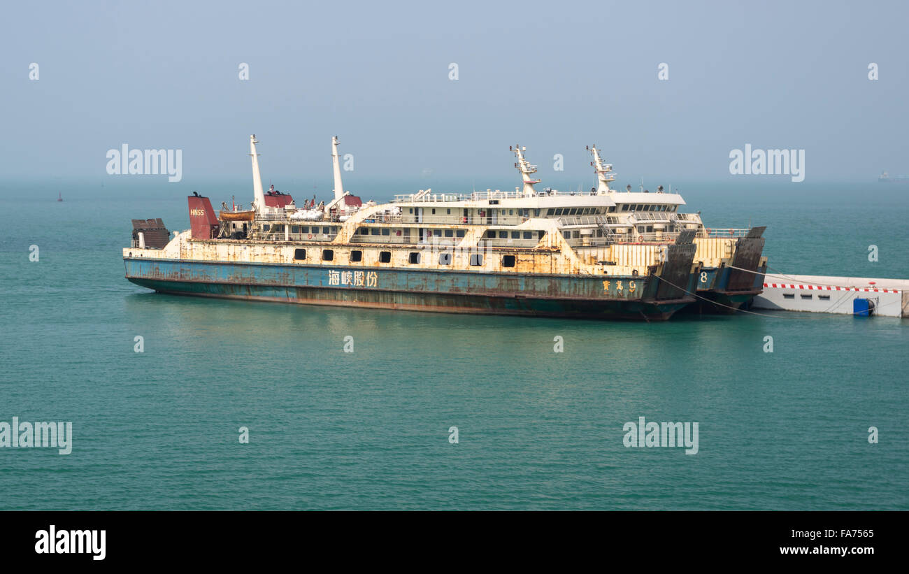 Rusty old car ferries in Haikou, South China, connecting Hainan island with the mainland. Stock Photo