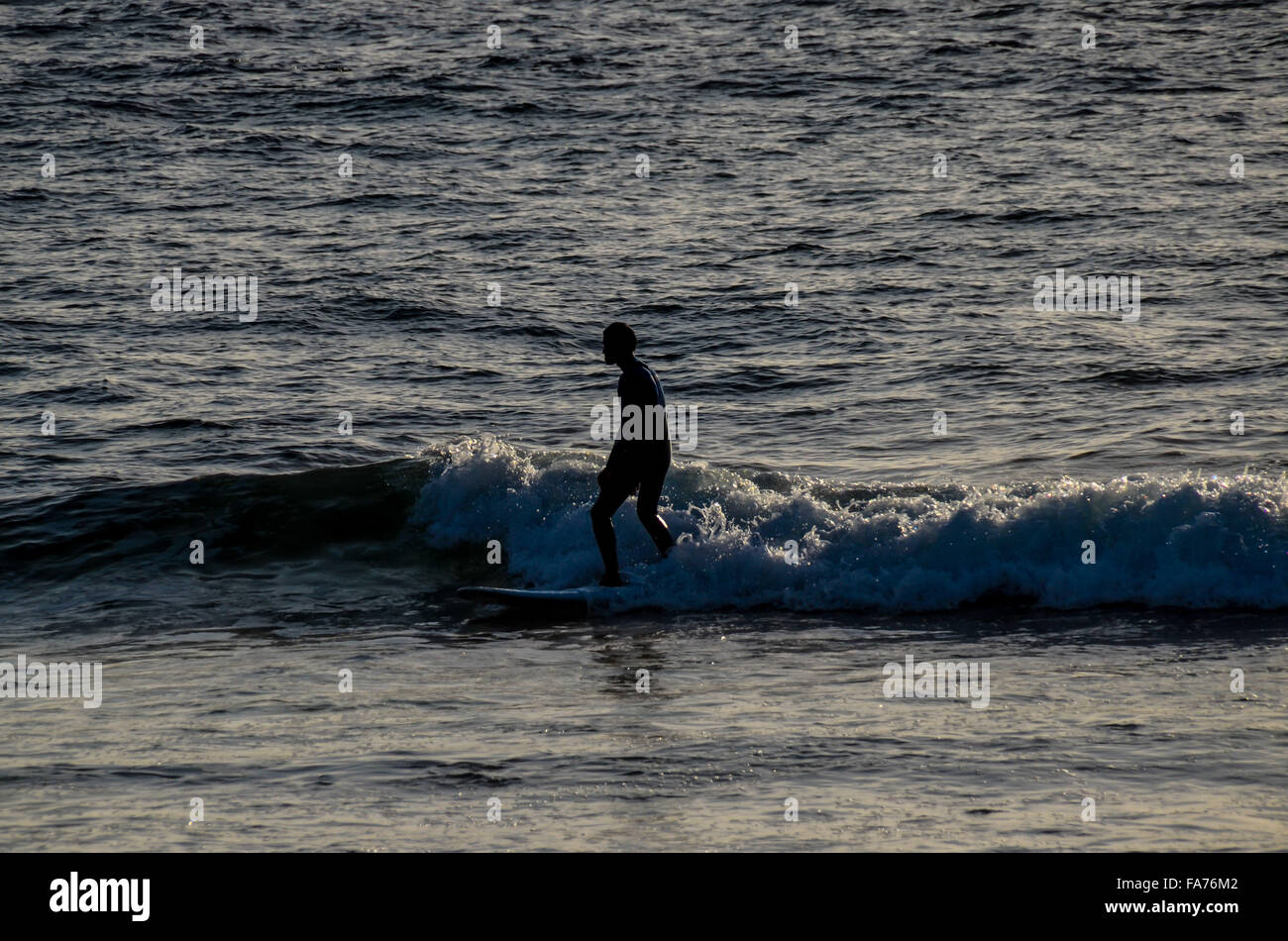Silhouette Surfer at Sunset Stock Photo - Alamy