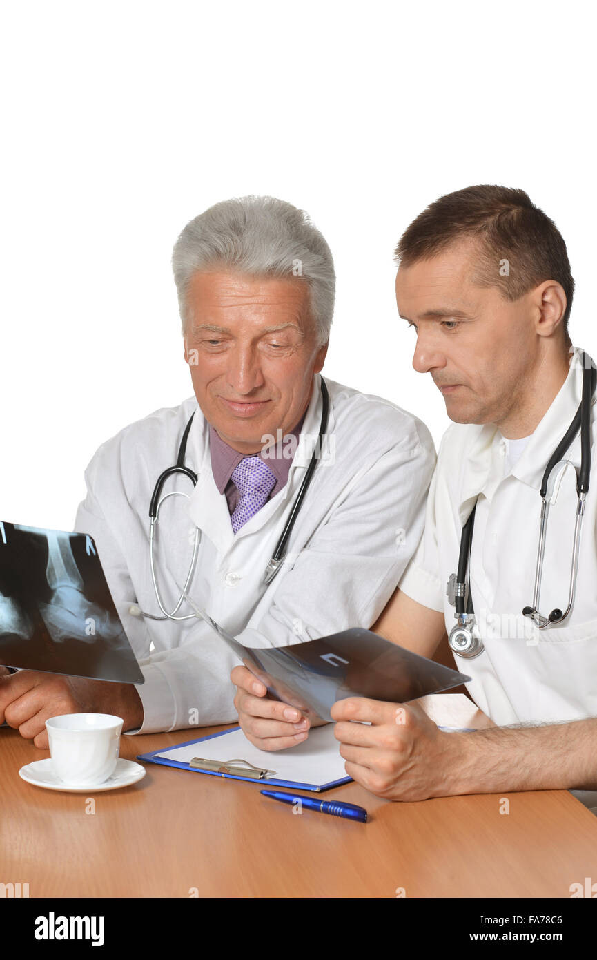 Two male doctors discussing xrays Stock Photo Alamy
