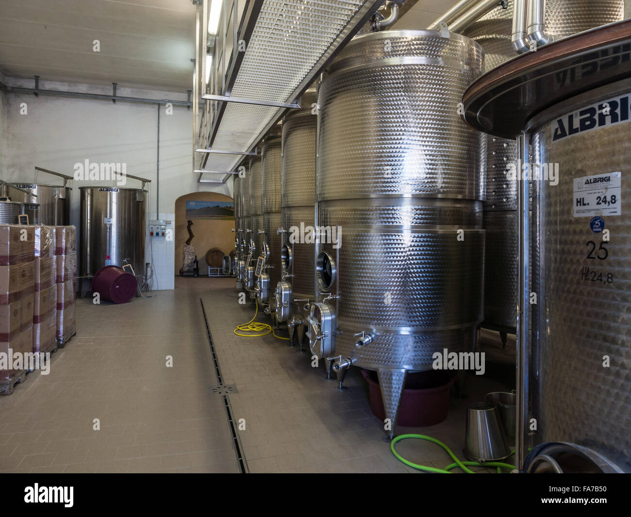 Wine making vats and equipment in winery in Tuscany Stock Photo