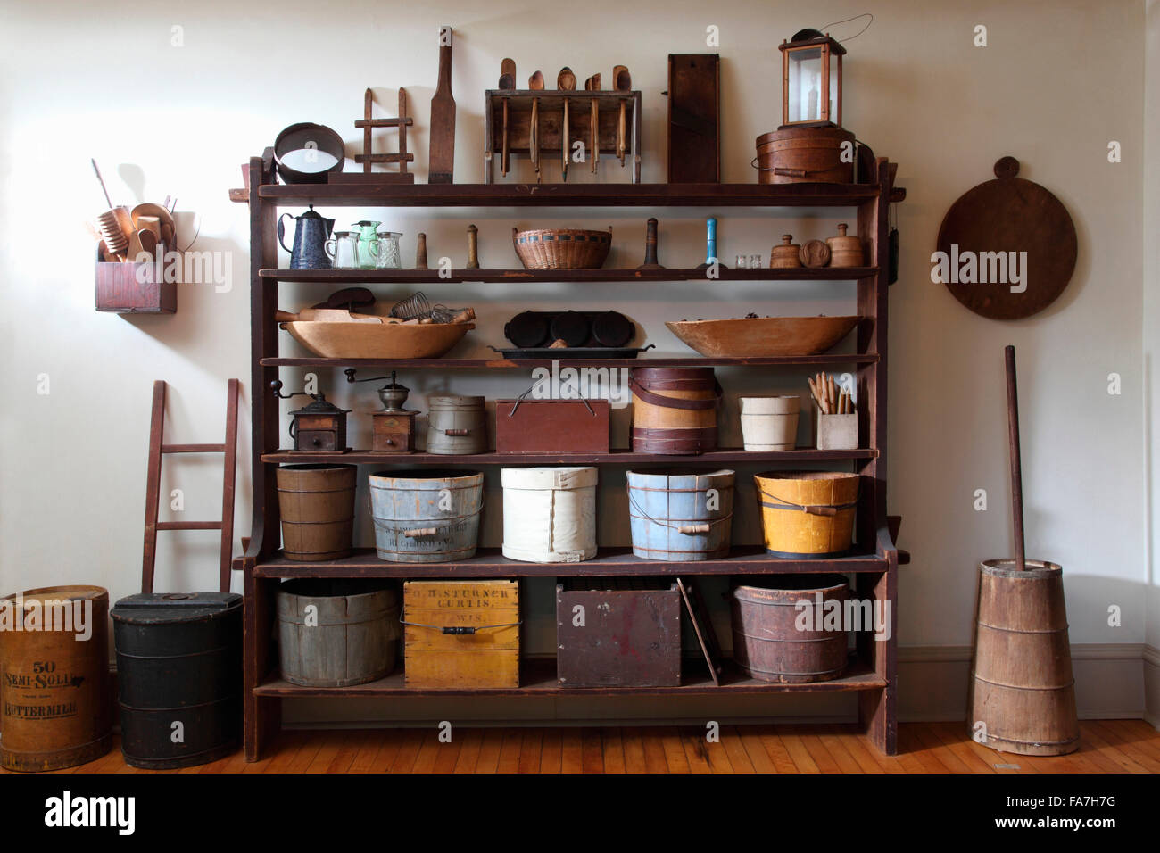 Items Displayed On Open Shelves In Hallway Or Pantry Stock Photo