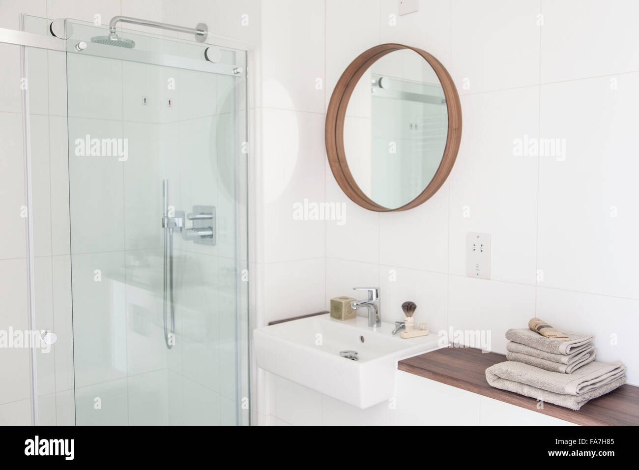 White bathroom in a modern country house in Cambridge. A house combining modern minimalist style with display of traditional objects used in every day life. Stock Photo