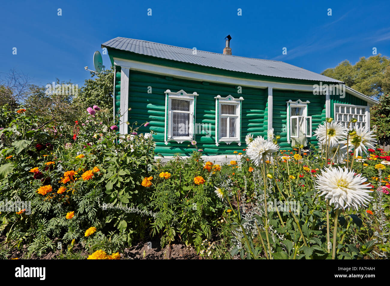 Green log country house with allotment garden. Kaluga region, Central Russia. Stock Photo