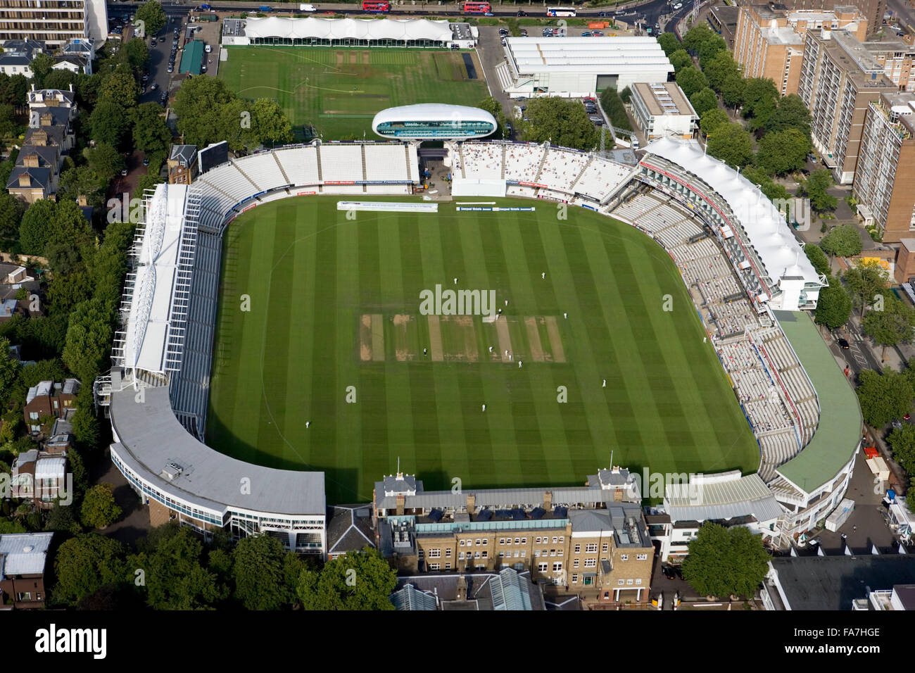 LORDS CRICKET GROUND, St Johns Wood, London. Founded on this site in 1814 the Home of Cricket is owned by the Marylebone Cricket Club (MCC), and is host to Middlesex County Cricket and the England and Wales Cricket Board. The match in progress is the firs Stock Photo