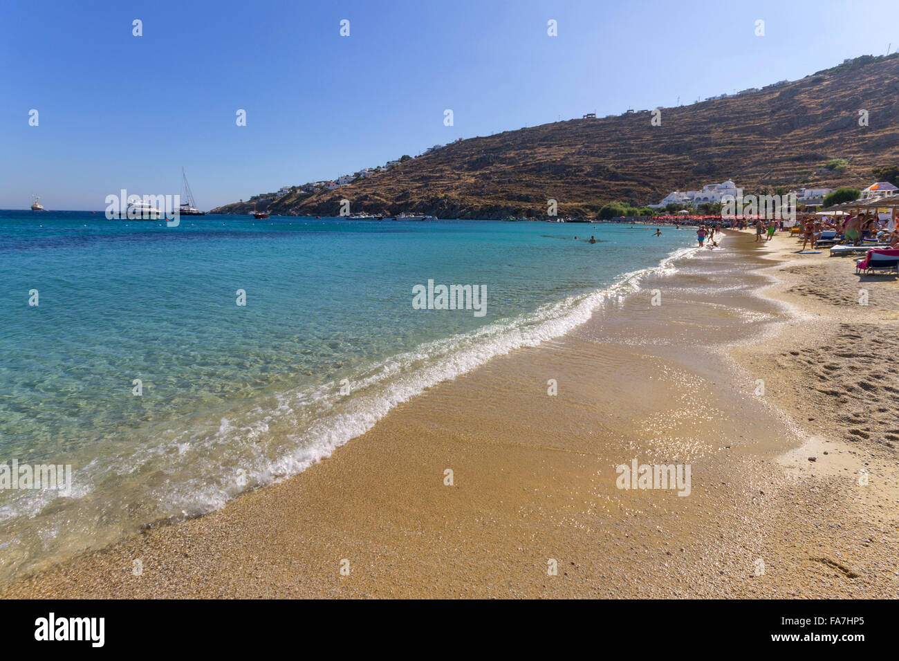 Dealer sells Louis Vuitton fake bags at Psarou beach. Mykonos, Greece,  Europe Stock Photo - Alamy