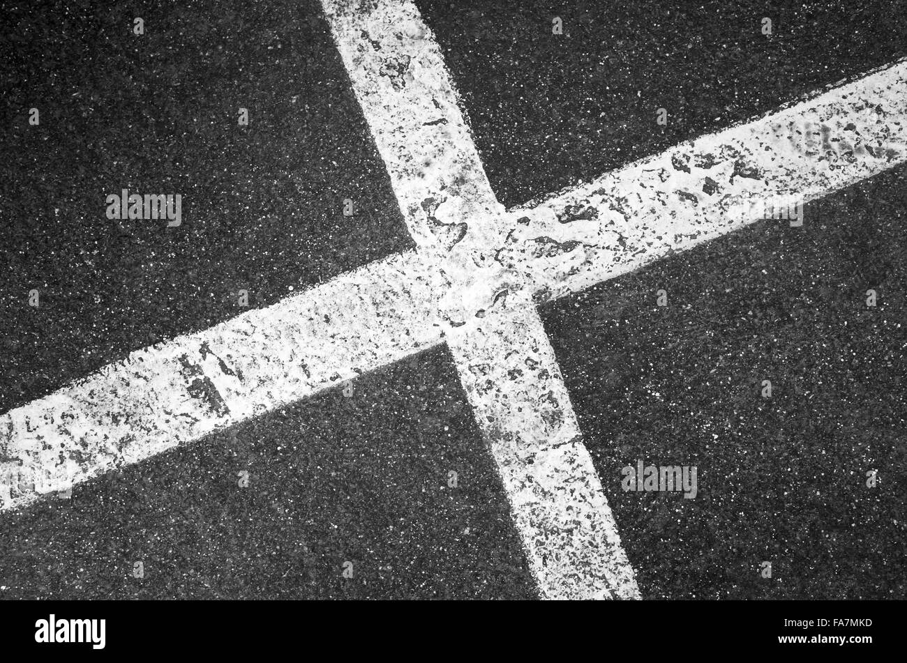 Crossing white lines on black asphalt, parking lot marking Stock Photo