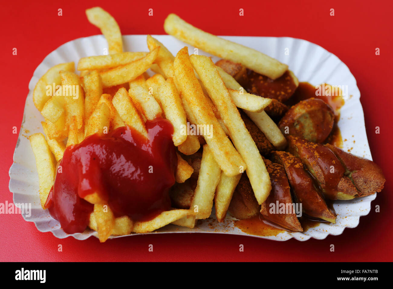 Currywurst and fries, with ketchup, at a currywurst stall in Berlin