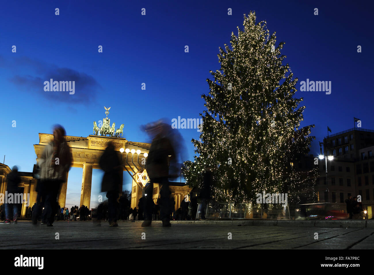 Tourists mill around the Brandenburg Gate in Berlin, Germany. A