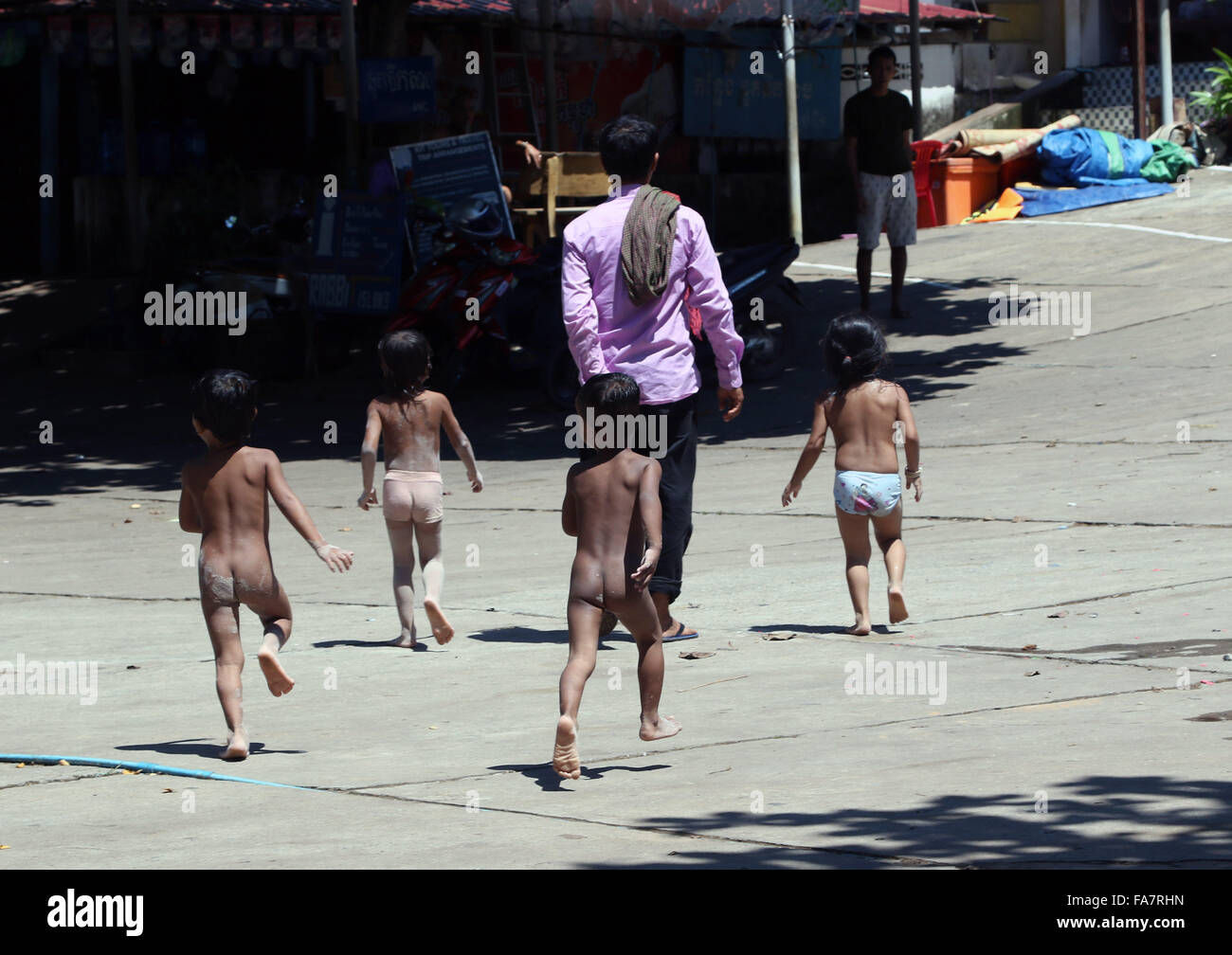 kids running barefoot street Stock Photo