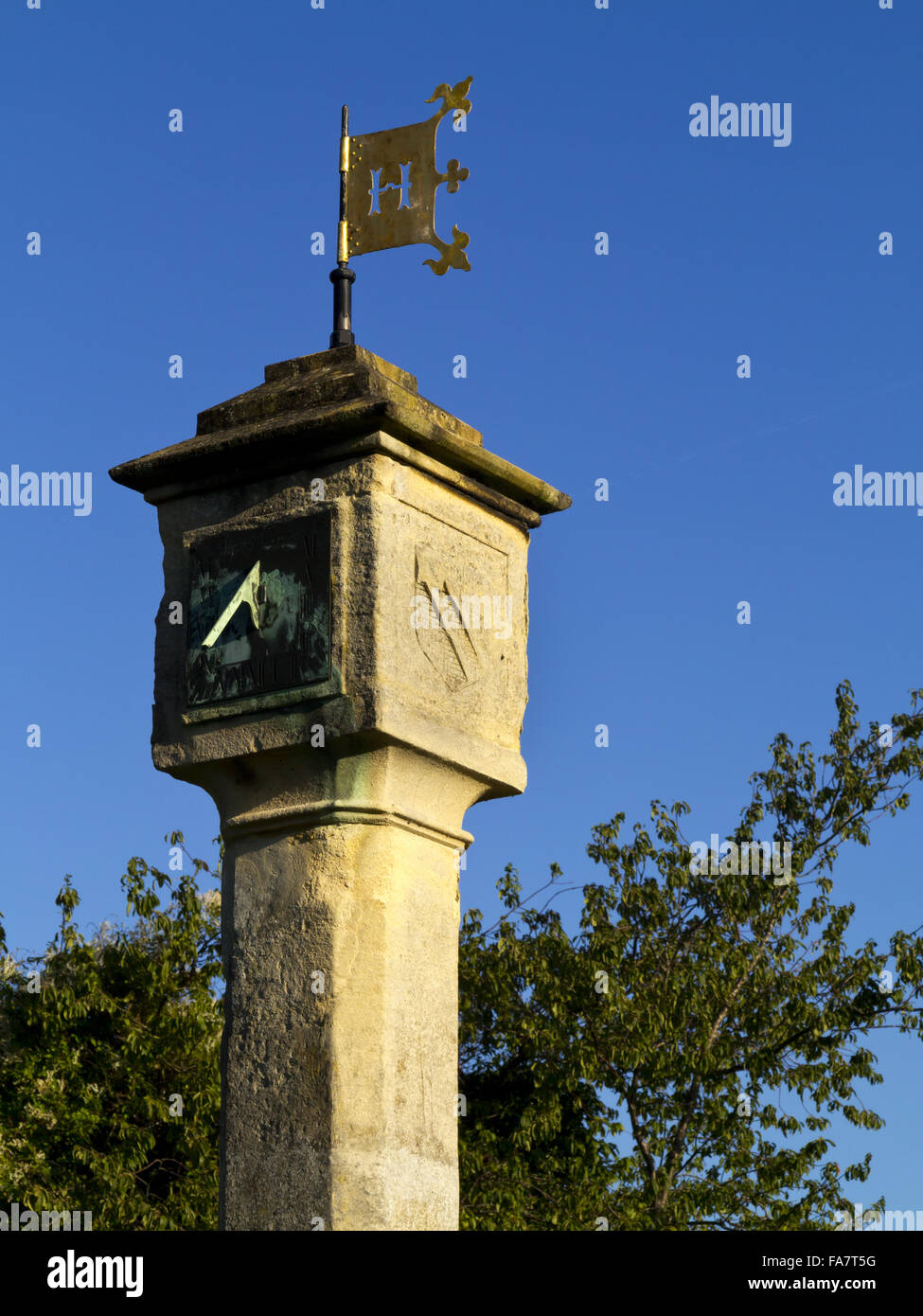 The sundial clock tower on the green at Blaise Hamlet in Bristol. The
