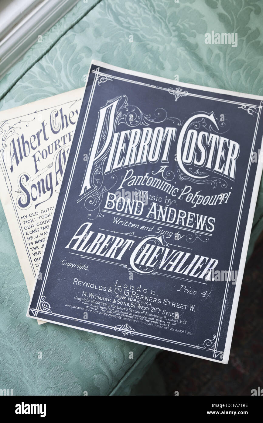 Two musical scores, featuring English actor and music hall performer Albert Chevalier (1861-1923), in the Drawing Room at Nuffield Place, Oxfordshire. Chevalier was a favourite of Lord Nuffield's, and this sheet music dates from around the 1890s. Nuffield Stock Photo