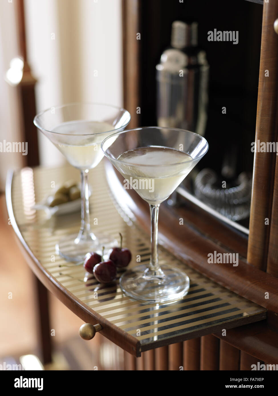 Detail of two Martini glasses on a drinks shelf, Portland House