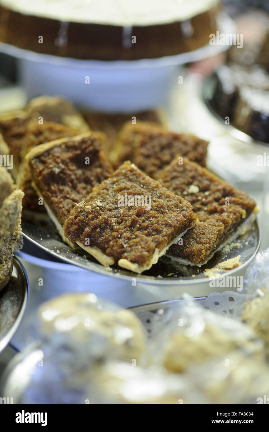 Treacle tart slices and other cakes, on display in the Servery, Box Hill, Surrey. Stock Photo