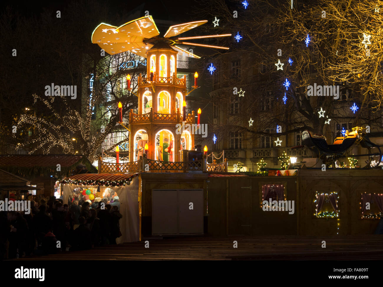 MUNICH, GERMANY - DECEMBER 12: Traditional christmas market at night with a illuminated pyramid in Munich, Germany on December 1 Stock Photo