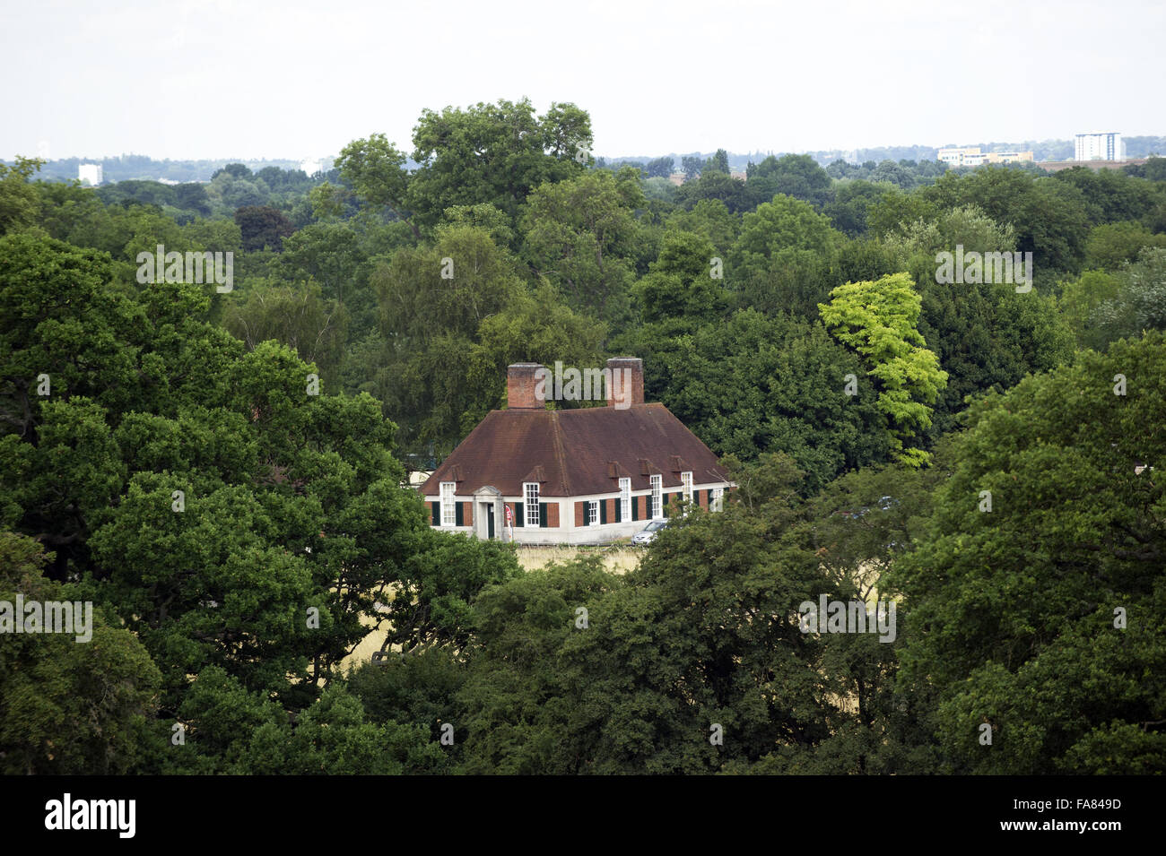 View of one of the Fairhaven Lodges surrounded by trees at Runnymede, Surrey. Stock Photo