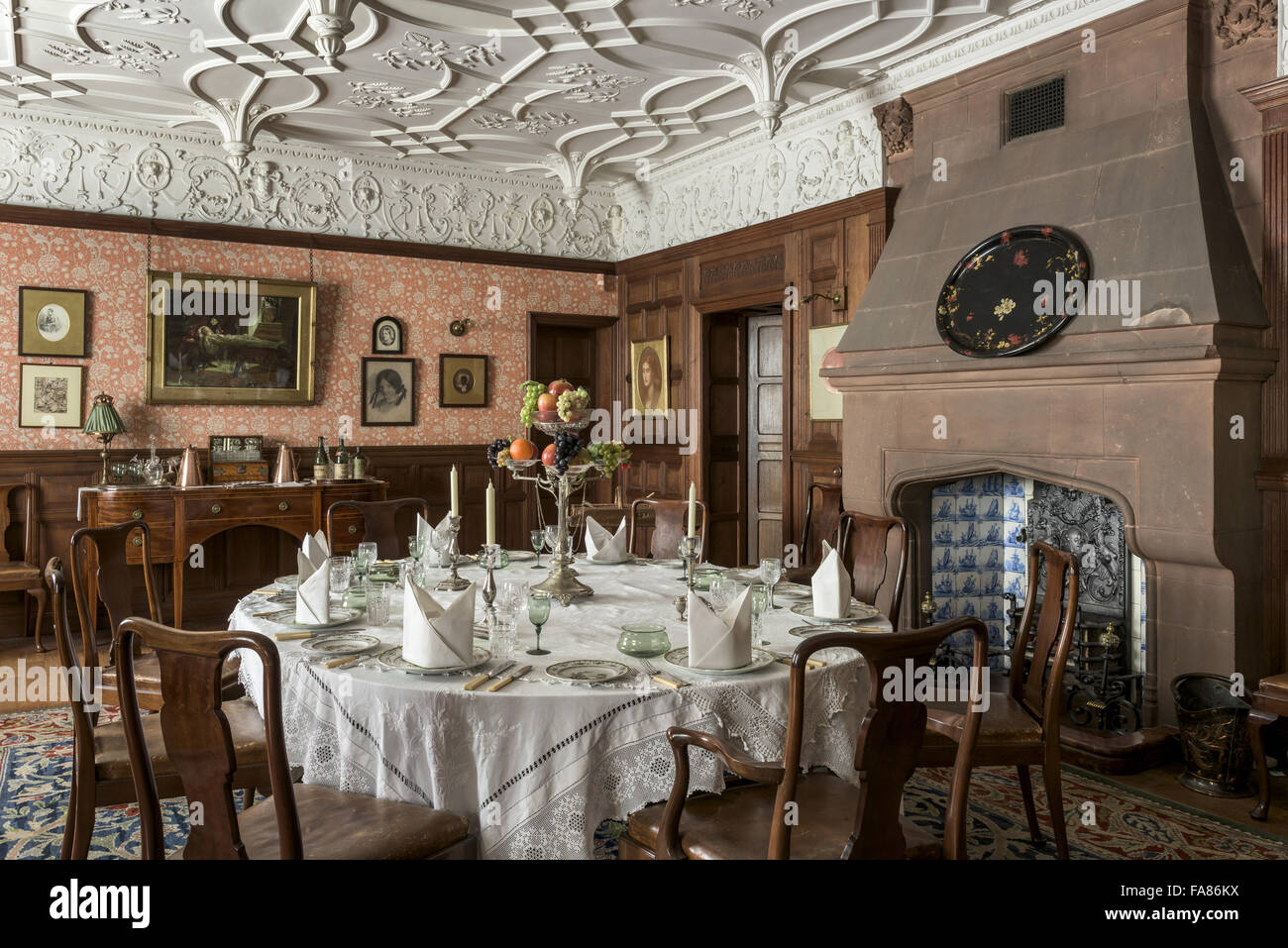 An interior view of Wightwick Manor and Gardens, West Midlands. Wightwick Manor was begun in 1887 in the 'Old English' style, and has a superb collection of William Morris fabrics and Pre-Raphaelite paintings. Stock Photo