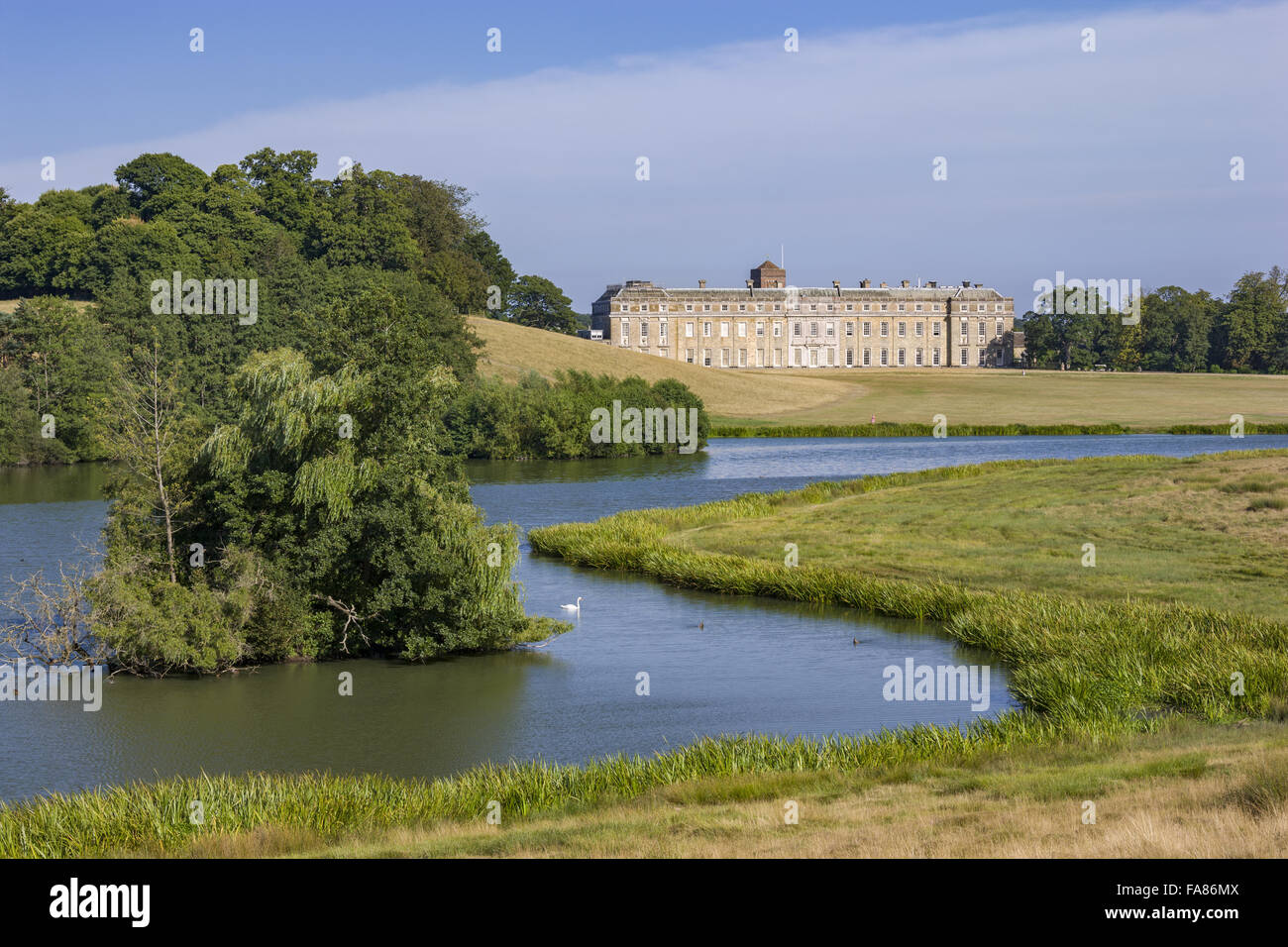 The house and upper pond at Petworth House and Park, West Sussex. The