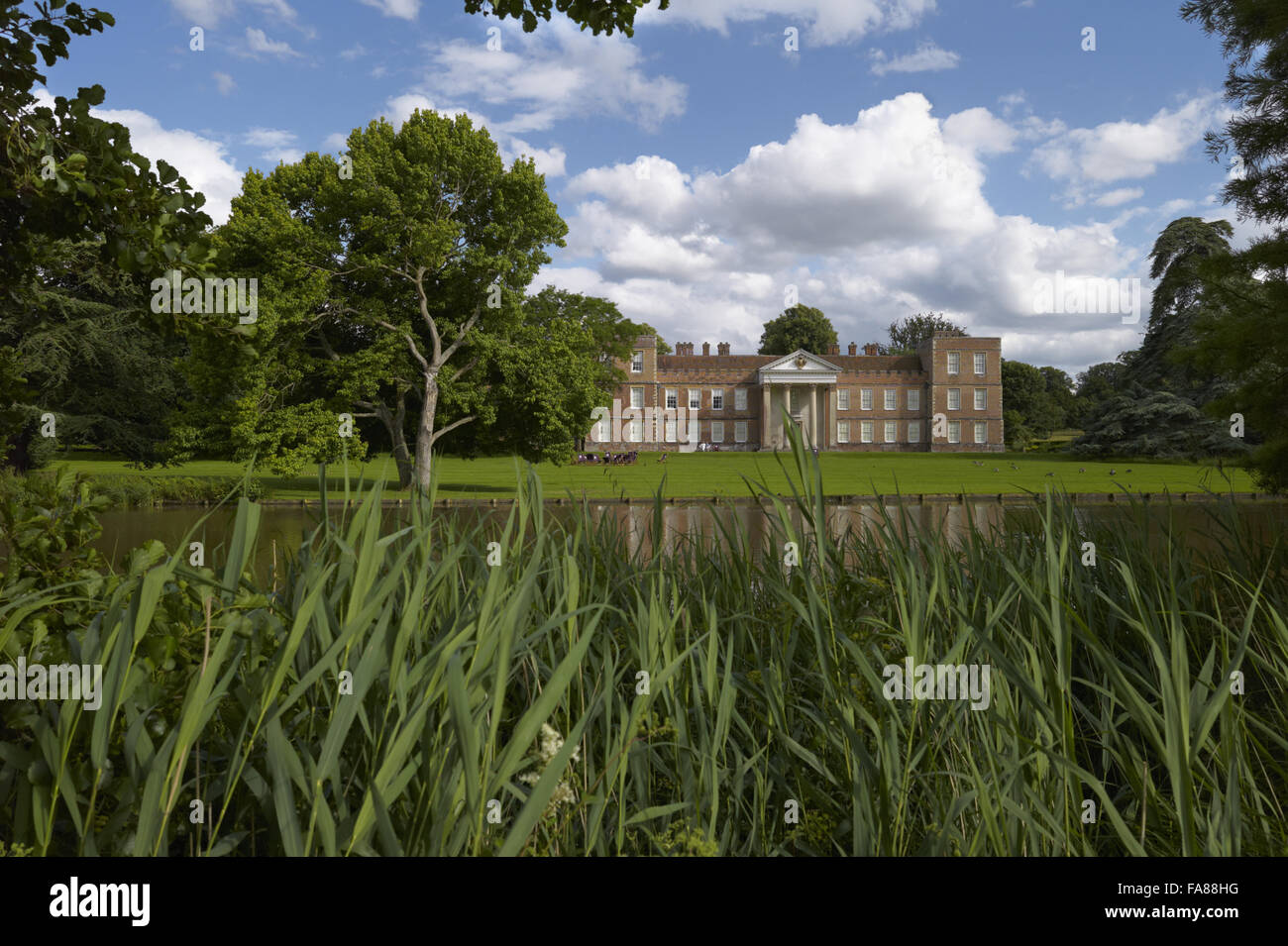 View of the north front of The Vyne and the lake. The house was built in the early 16th century for Lord Sandys, Henry VIII's Lord Chamberlain in 1526. Stock Photo