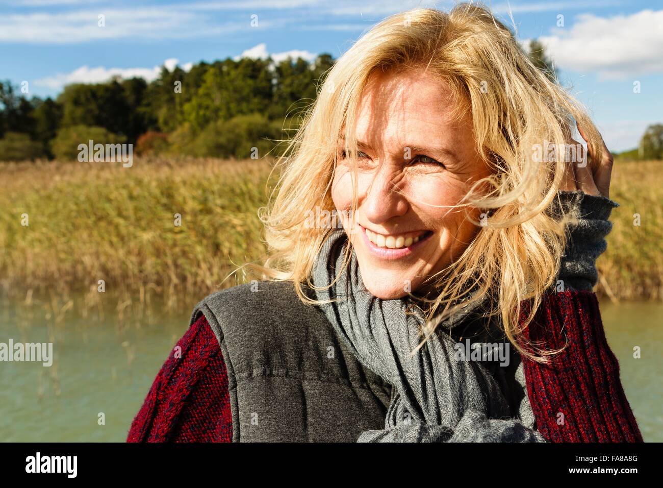 Portrait of mature woman, outdoors, smiling Stock Photo - Alamy
