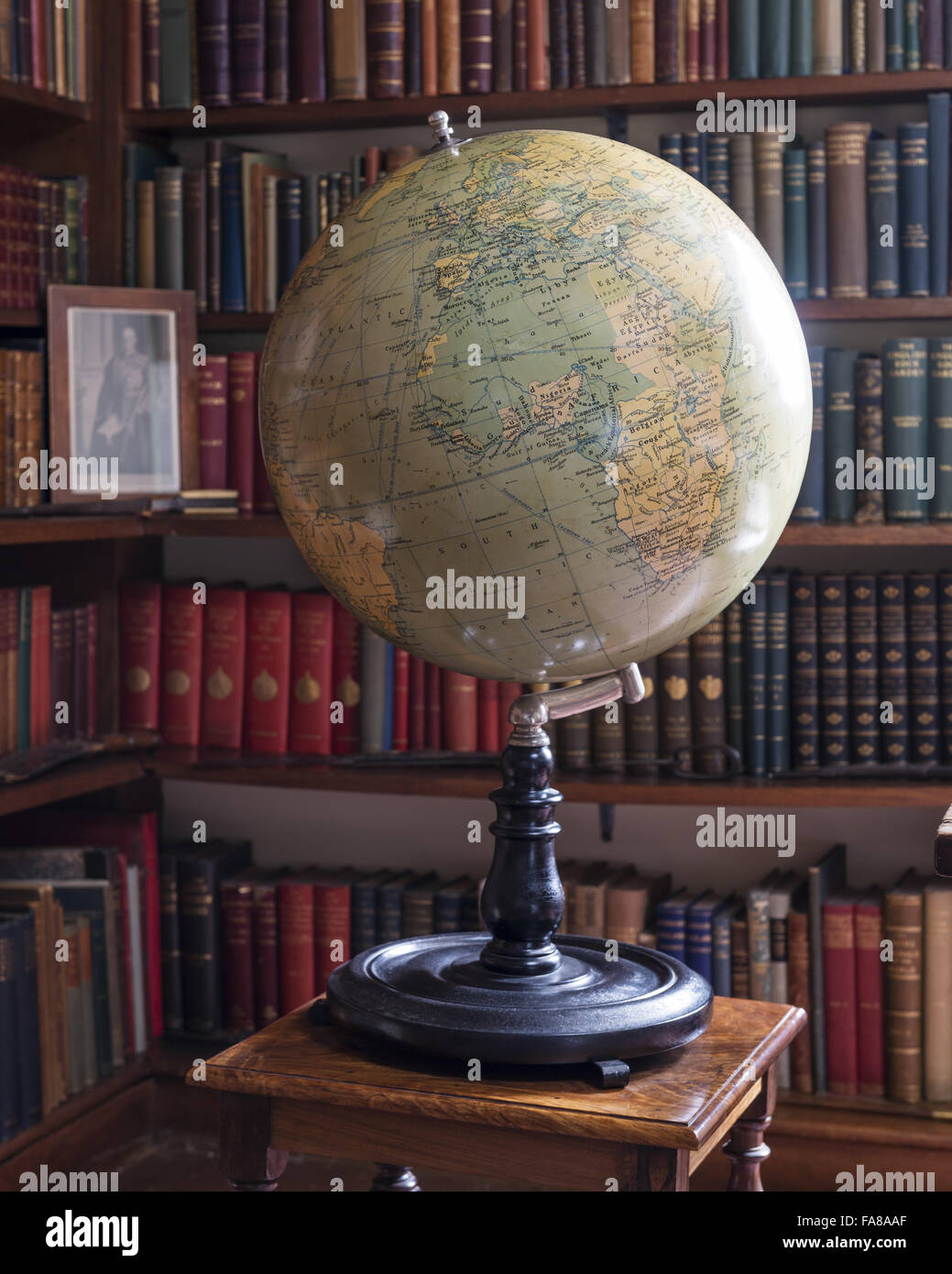 A terrestial globe in the Study at Bateman's, East Sussex. Made by Philips. Ebony and Metal. Bateman's was the home of the writer Rudyard Kipling from 1902 to 1936. Stock Photo