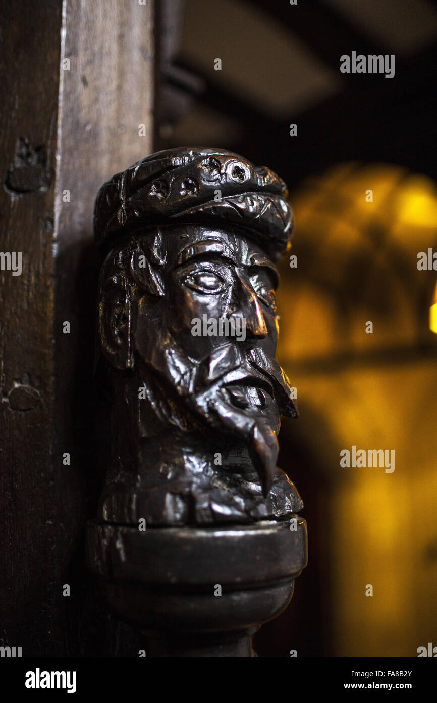 A Saracen's head carved on a newel post in the Staircase Hall at Ightham Mote, Kent. Ightham Mote is a medieval moated manor house near Sevenoaks. The head was the crest of the Selby family who owned Ightham Mote for nearly 300 years. Stock Photo