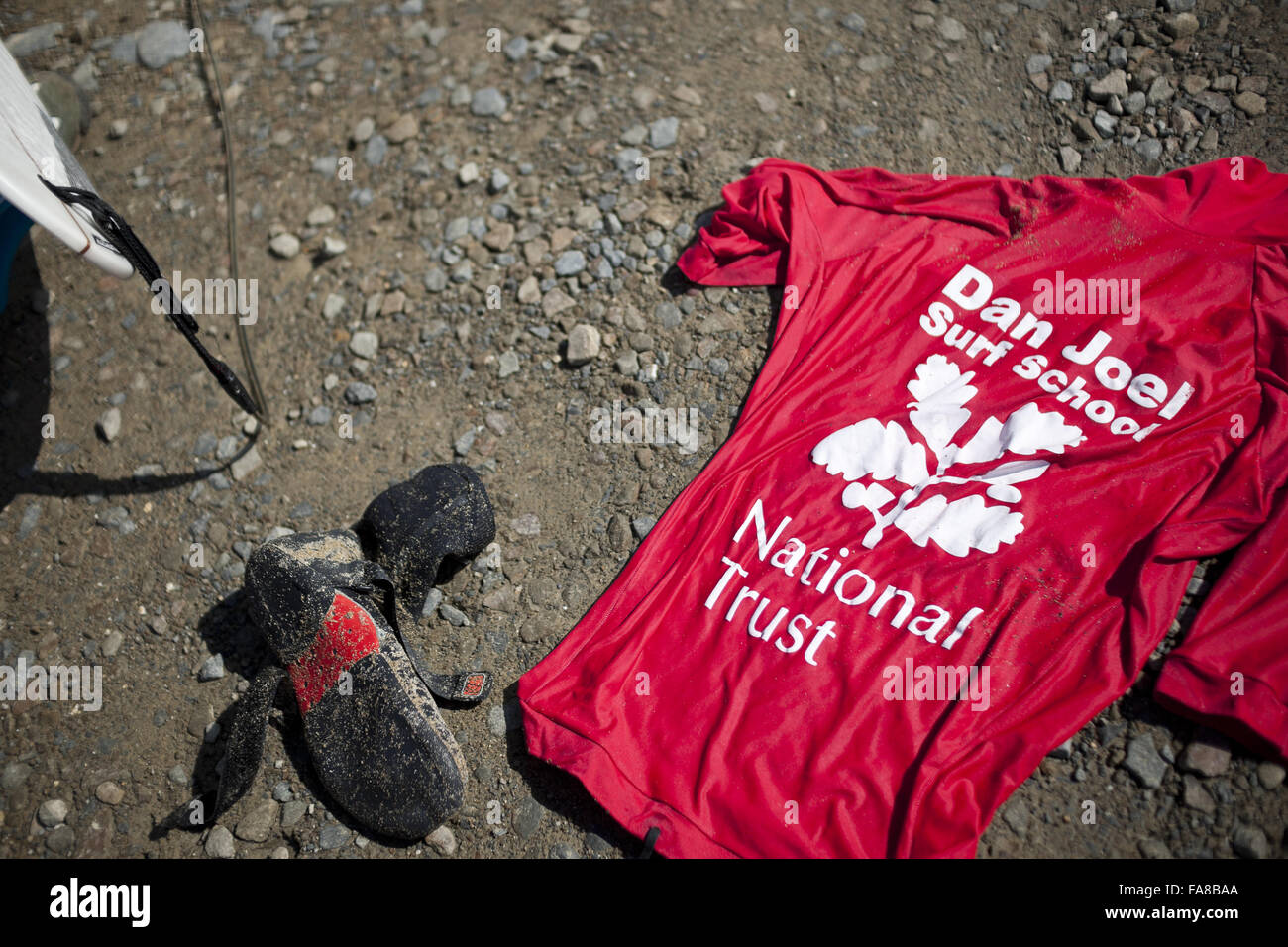 National Trust Surf School t-shirt at Sandy Mouth, Cornwall. Stock Photo