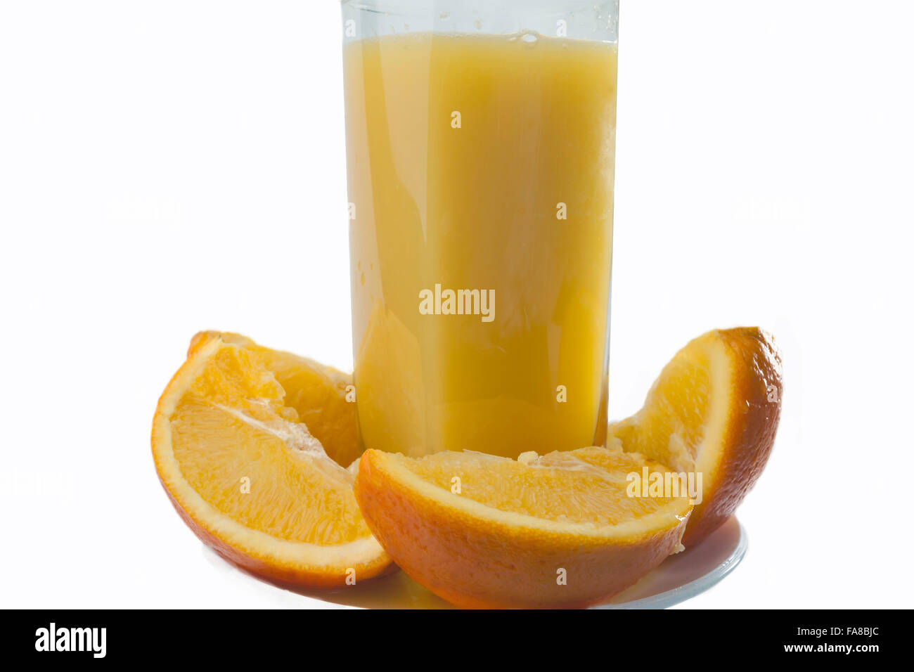 Orange juice and slices of orange isolated on white. Stock Photo