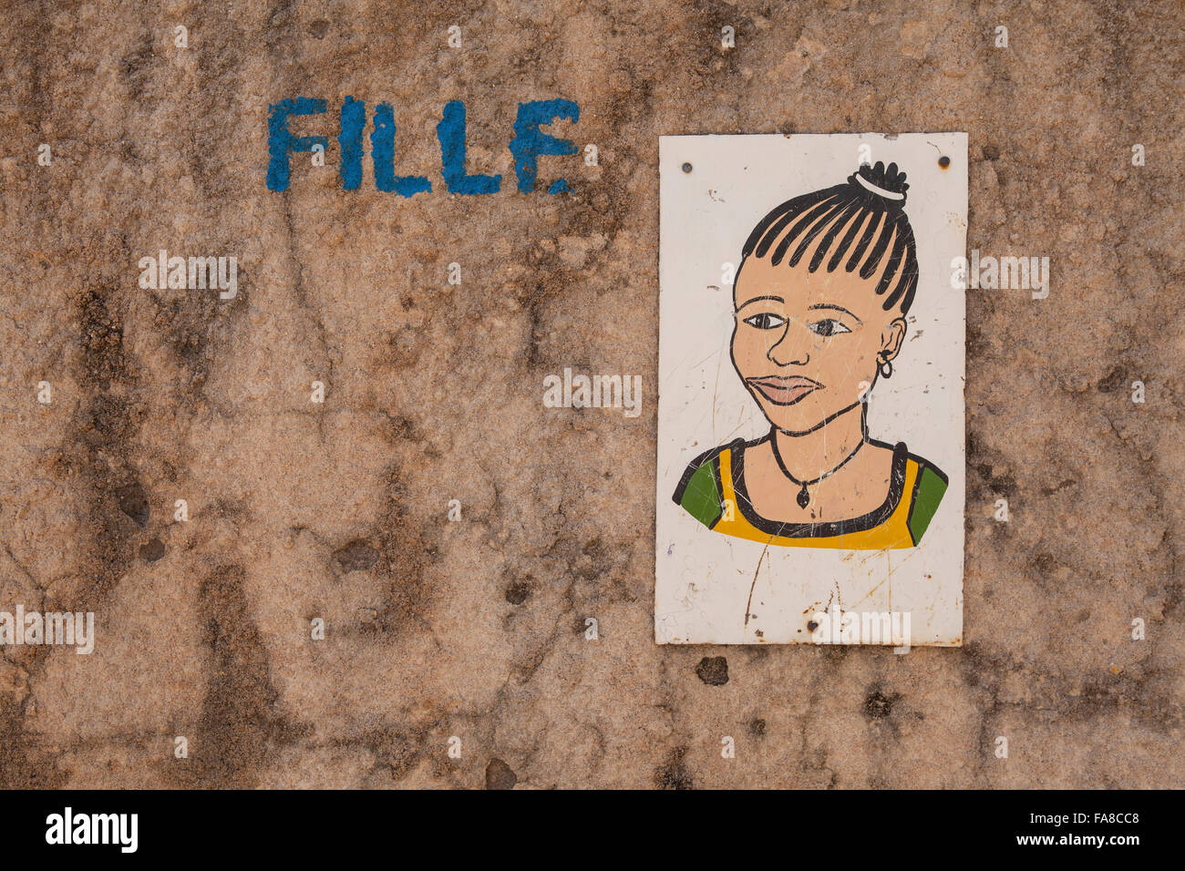 Gender-specific signs are posted outside toilets at Kouka Primary School, a BRIGHT School in Kouka Department, Burkina Faso. Stock Photo