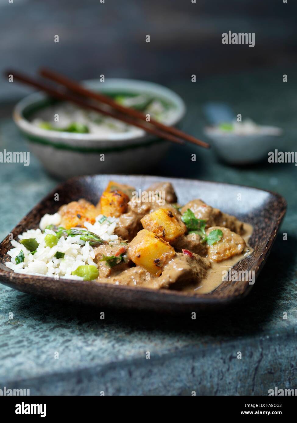 Dish of beef massaman curry with asparagus rice Stock Photo