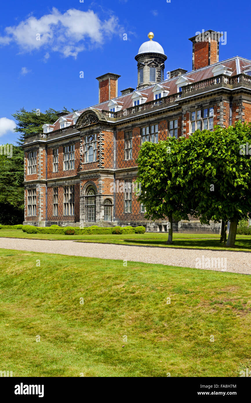 The south front of Sudbury Hall, Derbyshire, with trees in foreground ...