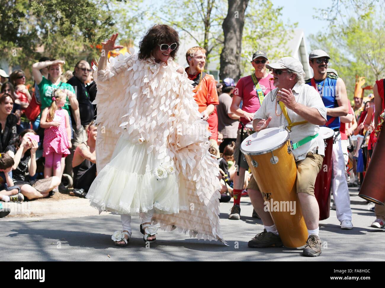 A smiling woman dancing at the May Day parade in Minneapolis Stock