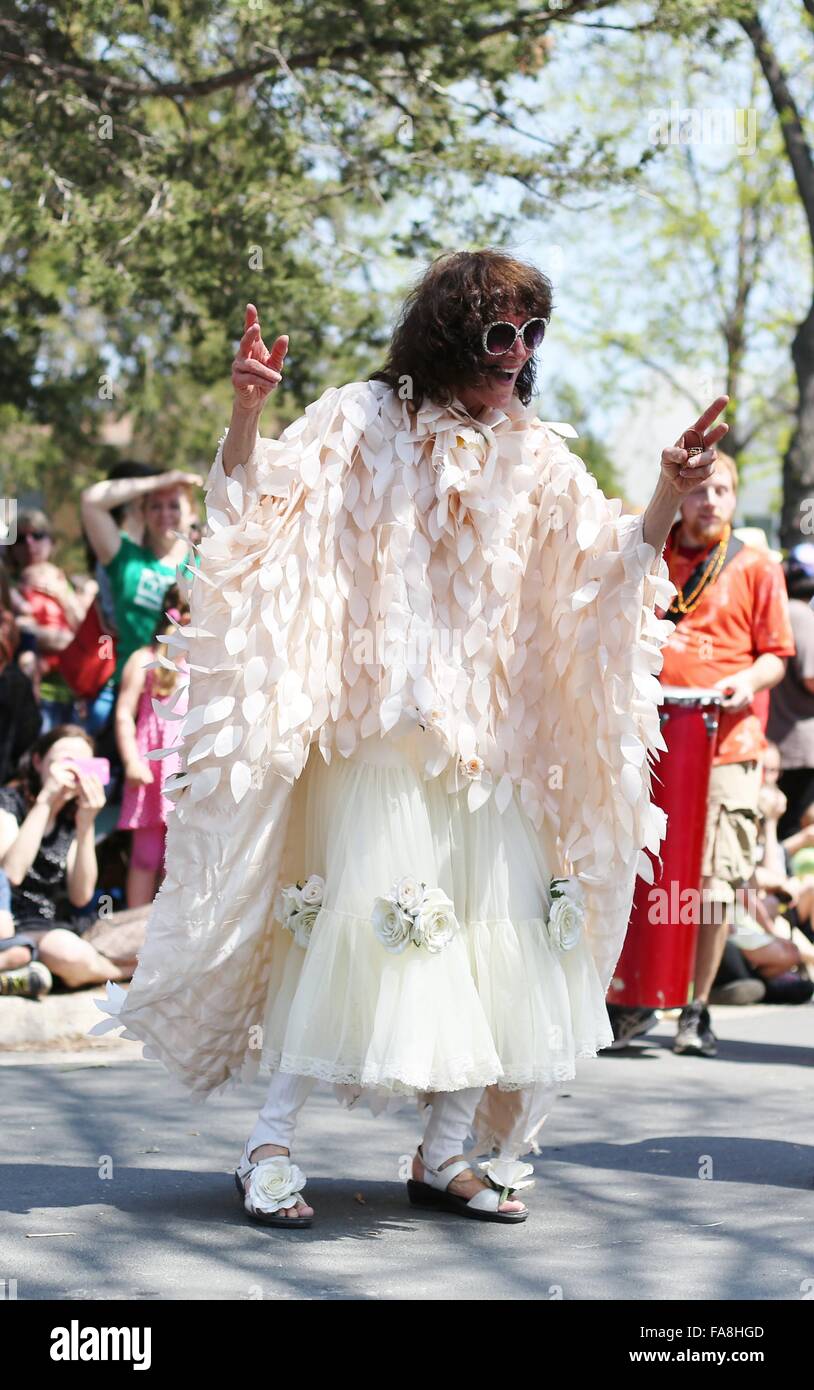 A smiling woman dancing at the May Day parade in Minneapolis. Stock Photo