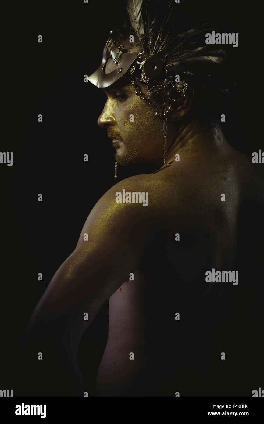 warrior helmet and gold feathers, giant iron sword Stock Photo Alamy