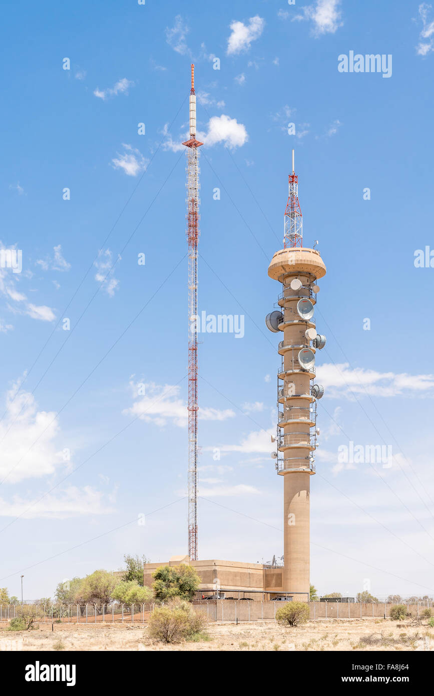 BLOEMFONTEIN, SOUTH AFRICA, DECEMBER 21, 2015: A microwave telecommunications tower and a TV and radio broadcast tower next to e Stock Photo