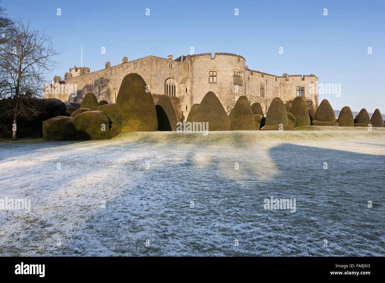 The east front and yew topiary in winter at Chirk Castle, Wrexham ...