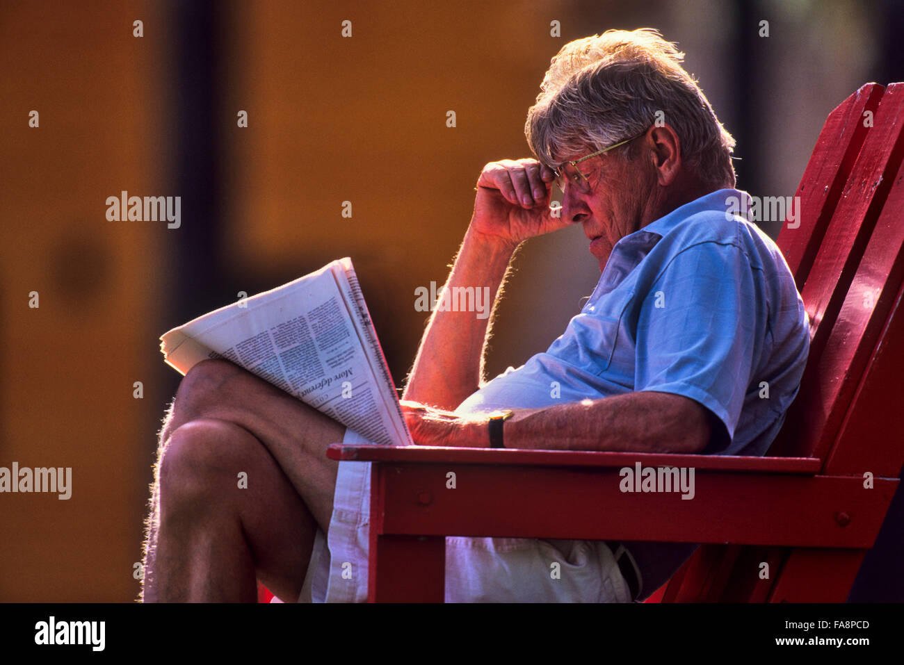 man relaxing with news paper in Jasper National Park Stock Photo