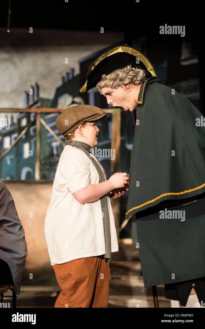 Secondary school teenage students pupils in a schools performance of  the musical 'Oliver!' based on the story Oliver Twist by Charles Dickens Stock Photo